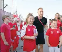  ?? — AFP ?? Denmark’s midfielder Christian Eriksen meets with fans at Al Sailiya SC in Doha, ahead of the Qatar 2022 World Cup.