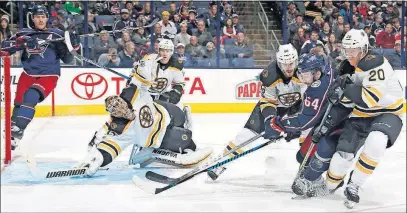  ?? [KYLE ROBERTSON/DISPATCH] ?? The Blue Jackets’ Tyler Motte (64) shoots against the Bruins on Monday. Motte played well enough to earn time Thursday against Florida, coach John Tortorella said.