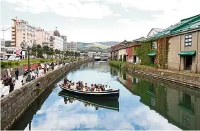  ?? NICHOLAS CHENG/The Star ?? A boat carrying tourists in the scenic Otaru Canal in Hokkaido, Japan. Otaru was the setting of the Japanese film, Love Letter. —
