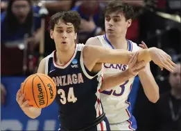  ?? RICK BOWMER — THE ASSOCIATED PRESS ?? Gonzaga forward Braden Huff is defended by Kansas forward Parker Braun during Saturday's NCAA Tournament second-round game in Salt Lake City.