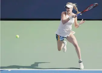  ?? SETH WENIG, THE ASSOCIATED PRESS ?? Canada’s Eugenie Bouchard blasts a return to Marketa Vondrousov­a of the Czech Republic during their second-round match Thursday in New York.