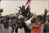  ?? HUSSEIN MALLA — THE ASSOCIATED PRESS ?? Sudanese protesters shout slogans as they march during a demonstrat­ion against the military council in Khartoum, Sudan, on Sunday.