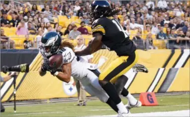  ?? DON WRIGHT — THE ASSOCIATED PRESS ?? Eagles defensive back Aaron Grymes (38) intercepts a pass in front of Pittsburgh wide receiver Sammie Coates in a preseason game last August. Grymes will likely get his first taste of real-season action Sunday against the Falcons.