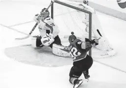  ?? AP ?? Capitals goaltender Braden Holtby, left, is scored on by Golden Knights left wing Tomas Nosek in the third period in Game 1 of the Stanley Cup Final Monday.