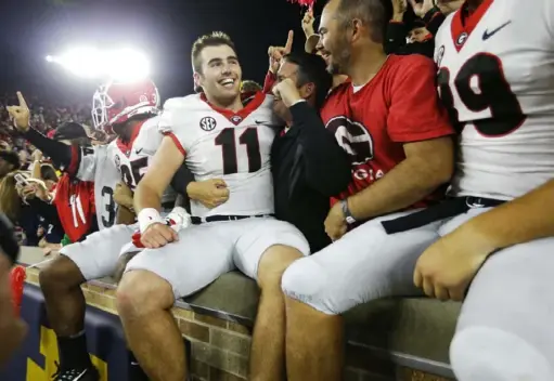  ?? Associated Press ?? Quarterbac­k Jake Fromm celebrates following Georgia’s 20-19 win at Notre Dame two years ago when he was a freshman starting his first game. In the second game of the home-and-home series, Fromm and the No. 3 Bulldogs are favored by two touchdowns.