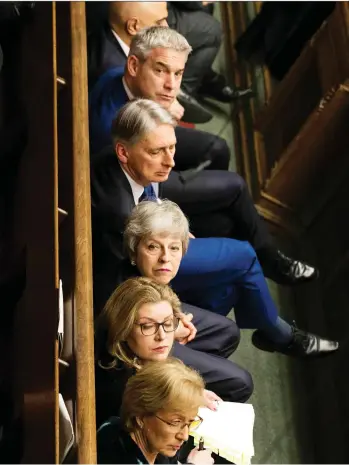  ?? MARK DUFFY/U.K. PARLIAMENT/VIA THE ASSOCIATED PRESS ?? Theresa May and her cabinet members listen during Prime Minister’s Questions in the House of Commons, London.