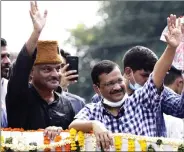 ?? ANI ?? Delhi Chief Minister Arvind Kejriwal with AAP Chief Minister candidate for Uttarakhan­d, Ajay Kothiyal, during a roadshow in Dehradun on Tuesday.