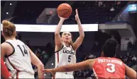  ?? Jessica Hill / Associated Press ?? UConn’s Paige Bueckers shoots against St. John’s in the first half on Friday in Hartford.