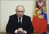  ?? MIKHAIL METZEL, SPUTNIK, KREMLIN POOL PHOTO VIA AP ?? Russian President Vladimir Putin addressees the nation from Moscow on Saturday.