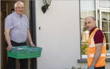  ??  ?? Brendan Furlong getting his groceries delivered by Keith Dempsey of Pettitt’s SuperValu.