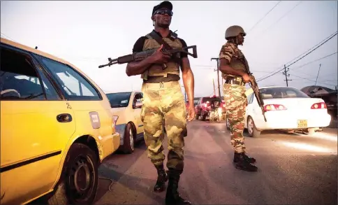  ??  ?? Soldiers of the 21st Motorised Infantry Brigade patrol in the streets of Buea, South-West Region of Cameroon. — AFP photos