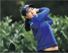  ?? STUART FRANKLIN/ GETTY IMAGES ?? South Korean In Gee Chun, 22, had a bogey on the fourth hole but otherwise played with great control, hitting six birdies in rainy and overcast conditions in France.