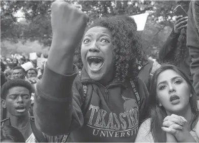  ?? JAY JANNER / AUSTIN AMERICAN-STATESMAN VIA AP ?? Arielle Moore, 19, argues with a Trump supporter during a protest at Texas State University in San Marcos on Nov. 10.