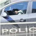  ??  ?? FOOTAGE Cop using phone at wheel