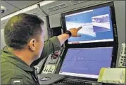  ?? REUTERS FILE ?? A US Navy crewman aboard a surveillan­ce plane shows purported Chinese constructi­on activity on South China Sea.