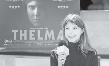  ??  ?? Cast member Eili Harboe (also below) speaks at a press conference for ‘Thelma’. • (Below left) Poster for ‘Thelma’.