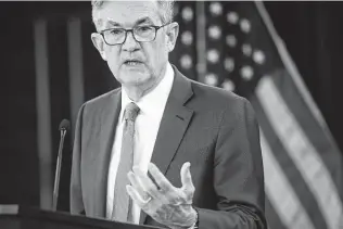  ?? Mark Makela / TNS ?? Federal Reserve Chair Jerome Powell says his colleagues have been clear that they want to see full employment and inflation slightly above 2 percent before lifting interest rates.