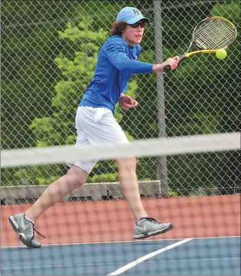  ?? Photo by Ernest A. Brown ?? Mount St. Charles No. 4 singles player Mitch McCoy helped the No. 3 Mounties defeat No. 6 Toll Gate, 4-0, in the Division II quarterfin­als Friday afternoon with a 6-1, 7-5 victory over Will Fox.