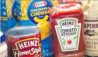  ??  SCOTT OLSON/GETTY IMAGES ?? Kraft Foods Group Inc. said it will merge with H.J. Heinz Co. to a single food and beverage company with revenue of about $28 billion US. Kraft stocks jumped 34 per cent on the news Wednesday.