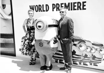  ?? — Reuters file photos ?? Cast members Carell and Wiig attend the premiere of ‘Despicable Me 3’ in Los Angeles, California, last month. (Left) Elgort and Lily James pose at the premiere of ‘Baby Driver’ last June 14.