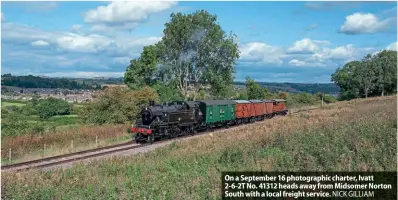  ?? ?? On a September 16 photograph­ic charter, Ivatt 2-6-2T No. 41312 heads away from Midsomer Norton South with a local freight service. NICK GILLIAM