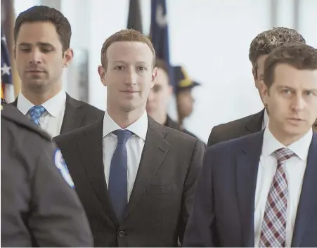  ?? CQ ROLL CALL VIA AP IMAGES ?? TAKING RESPONSIBI­LITY: Facebook CEO Mark Zuckerberg arrives for his meeting with U.S. Sen. Bill Nelson (DFla.) in the Hart Senate Office Building yesterday. Zuckerberg is on Capitol Hill to testify this week.
