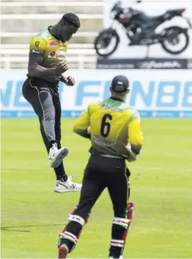  ?? (Photo: CPL via Getty Images) ?? Carlos Brathwaite (left) of Jamaica Tallawahs celebrates the dismissal of Sunil Narine of Trinbago Knight Riders (not in frame) during the Hero Caribbean Premier League match 21 between Jamaica Tallawahs and Trinbago Knight Riders at Brian Lara Cricket Academy in Tarouba, Trinidad and Tobago, earlier this year.