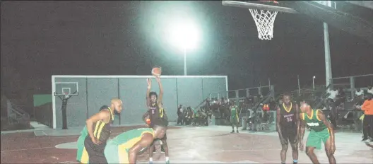  ?? ?? A Mambas player attempting a free throw after being fouled by Kwakwani