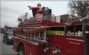  ?? MEDIANEWS GROUP FILE PHOTO ?? The man in red who everyone was waiting for, Santa Claus makes his appearance at the Lansdale 69th Mardi Gras Parade in 2019.