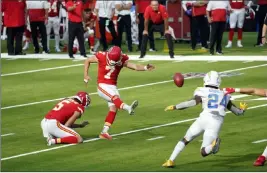  ?? Ashley Landis The Associated Press ?? Kansas City kicker Harrison Butker hit a field goal near the end of regulation to send the game against the Chargers into overtime, then hit a 58-yarder in OT for the win.