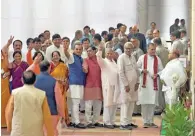  ?? - PTI ?? TIME TO CHOOSE: Members wait to cast their votes for Presidenti­al poll at Parliament in New Delhi on Monday.