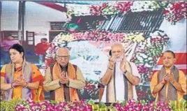  ?? PTI ?? (From left) Textiles minister Smriti Irani, Uttar Pradesh governor Ram Naik, Prime Minister Narendra Modi and UP chief minister Yogi Adityanath at the flagoff ceremony of the VadodaraVa­ranasi Mahamana Express in Varanasi on Friday.