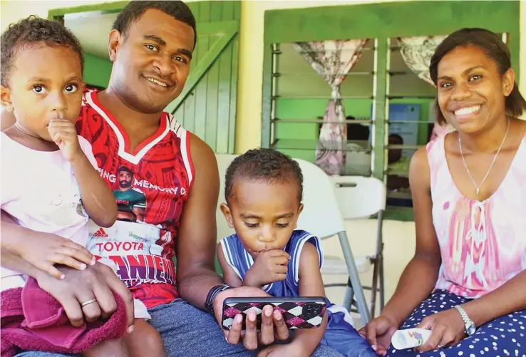  ?? ?? Kasanita Liku and Seru Rakuro with their children Ulamila and Tevita, taking advantage of the REACH programme in Batiri village.