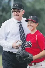  ?? DAN JANISSE ?? Windsor Mayor Drew Dilkens tossed the ceremonial first pitch to Team Ontario catcher Jennifer Gilroy.