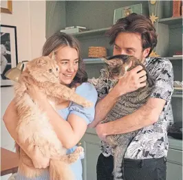  ??  ?? ● Kate Spiers in the kitchen of her gorgeous Glasgow flat, main, and with husband Jordan and cats Babyman and Mouse, left
Main picture Andrew Cawley