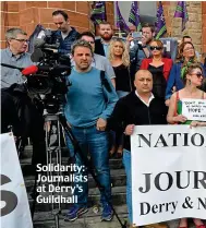  ??  ?? Solidarity: Journalist­s at Derry’s Guildhall