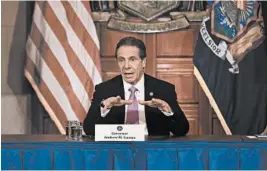  ?? BENNETT RAGLIN/GETTY ?? New York Governor Andrew Cuomo speaks during his daily news conference amid the coronaviru­s outbreak on Friday in New York City.