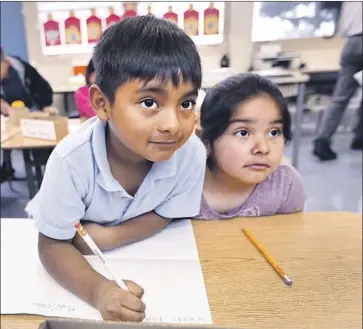  ?? Allen J. Schaben Los Angeles Times ?? L.A. UNIFIED has about 860 campuses, including magnet schools, dual-languge programs, affiliated charter schools and permits with transporta­tion. Above, students at Sunrise Elementary School in Boyle Heights.