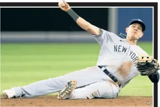  ?? ?? SOLID GROUND: Gio Urshela throws out Lourdes Gurriel Jr. at first base after making a diving play during the eighth inning of the Yankees’ 6-5 loss to Toronto.