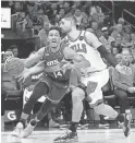  ?? ROB SCHUMACHER/THE REPUBLIC ?? Suns guard Landry Shamet (14) is fouled by Bulls center Nikola Vucevic on Wednesday night at Footprint Center.