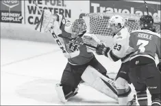  ??  ?? Lethbridge Hurricanes goalie Stuart Skinner blocks a high shot in Game 5 of the WHL Eastern Conference final against the Regina Pats Friday at the Brandt Centre.