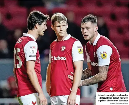  ?? Robbie Stephenson/JMP ?? Joe Low, right, endured a difficult full debut for City against Lincoln on Tuesday