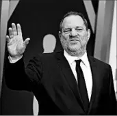  ?? JORDAN STRAUSS/INVISION 2014 ?? Harvey Weinstein was fired Sunday following an expose that detailed decades of sexual harassment allegation­s.