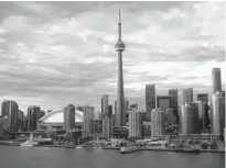  ?? REUTERS/HYUNGWON KANG ?? The Toronto city skyline is shown in this aerial photo over Lake Ontario in Toronto on Nov. 1, 2015.