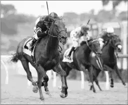  ?? BENOIT PHOTO ?? Vexatious earns her first career stakes victory Wednesday in the 1 3/8-mile CTT and TOC Stakes at Del Mar.