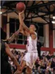  ?? ADRIANNA LYNCH — FOR DIGITAL FIRST MEDIA ?? Archbishop Carroll’s Justin Anderson puts up a shot Friday night against Archbishop Wood.