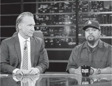  ??  ?? Host Bill Maher, left, appears with actor-rapper Ice Cube during a broadcast of Real Time With Bill Maher, when Maher apologized for using a racial slur in a previous broadcast.