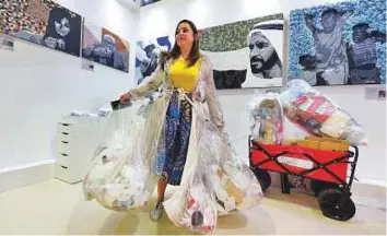  ?? Pankaj Sharma/Gulf News ?? Mariska Nell wearing garbage bags to spread awareness about reducing trash at World Art Dubai.