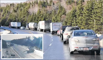  ?? CAPE BRETON POST PHOTO/ PROVINCE OF NOVA SCOTIA PHOTO ?? Traffic was backed up for much of the day on Highway 105 near Kellys Mountain on Friday as RCMP investigat­ed a crash involving a school bus and a trailer parked partially on the road. The bus driver was seriously injured while the 11 students onboard...