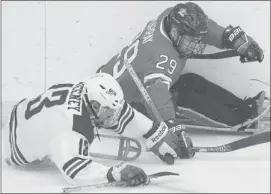  ?? Ted Rhodes/calgary Herald ?? Canada’s Graeme Murray, 29, battles Josh Sweeney of Team USA during the second period at World Sledge Hockey Challenge at Calgary’s Winsport on Wednesday.